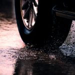 With nearly 800,000 crashes occurring on wet roads every year, AAA urges drivers to check tread depth, replace tires proactively, and increase following distances significantly during rainy conditions.