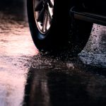 With nearly 800,000 crashes occurring on wet roads every year, AAA urges drivers to check tread depth, replace tires proactively, and increase following distances significantly during rainy conditions.